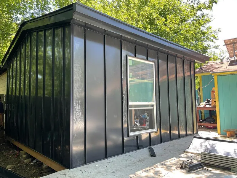 Black standing seam metal wall panels for Roof Inspection in Ira